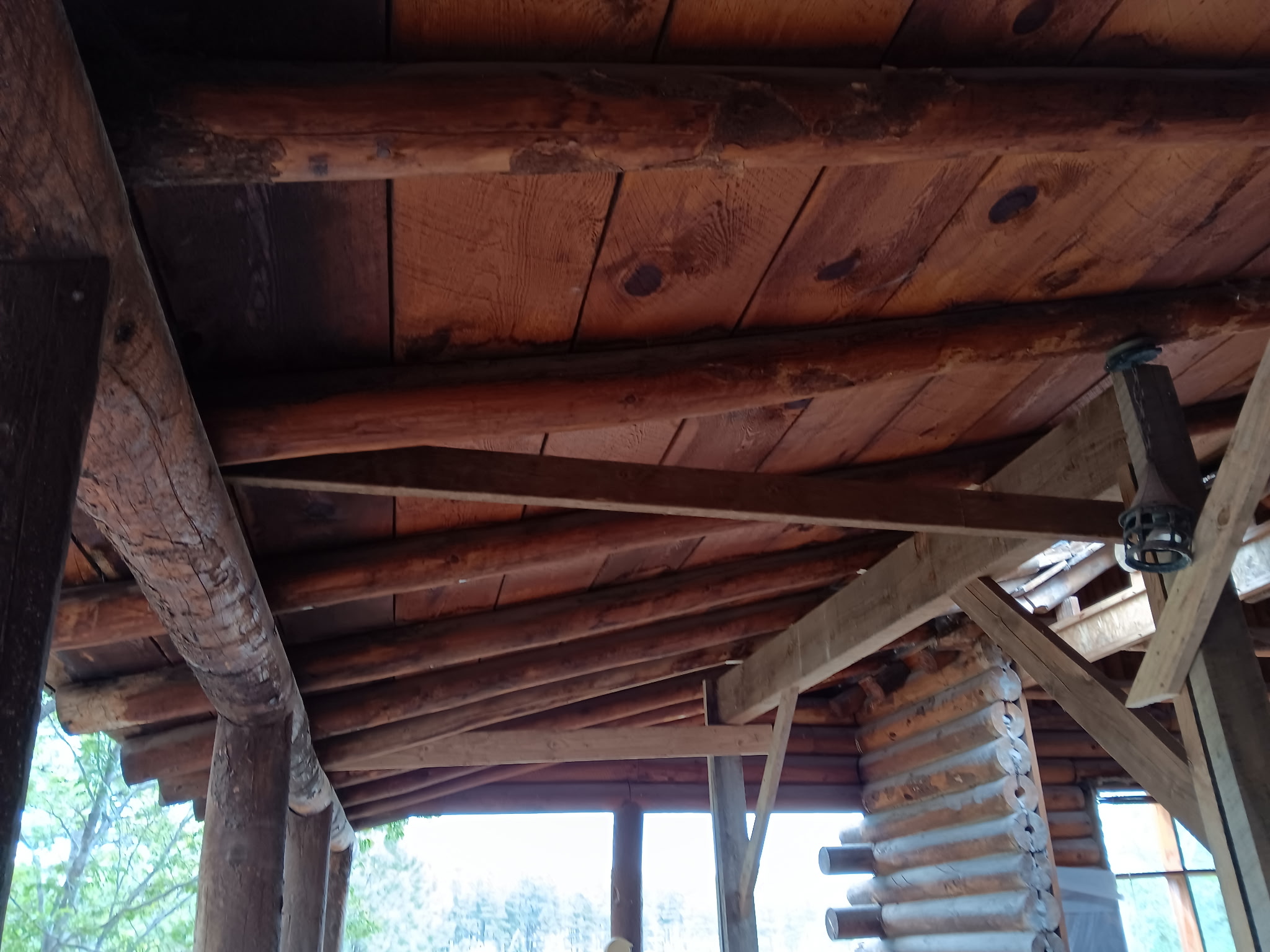 Log cabin porch before sandblasting